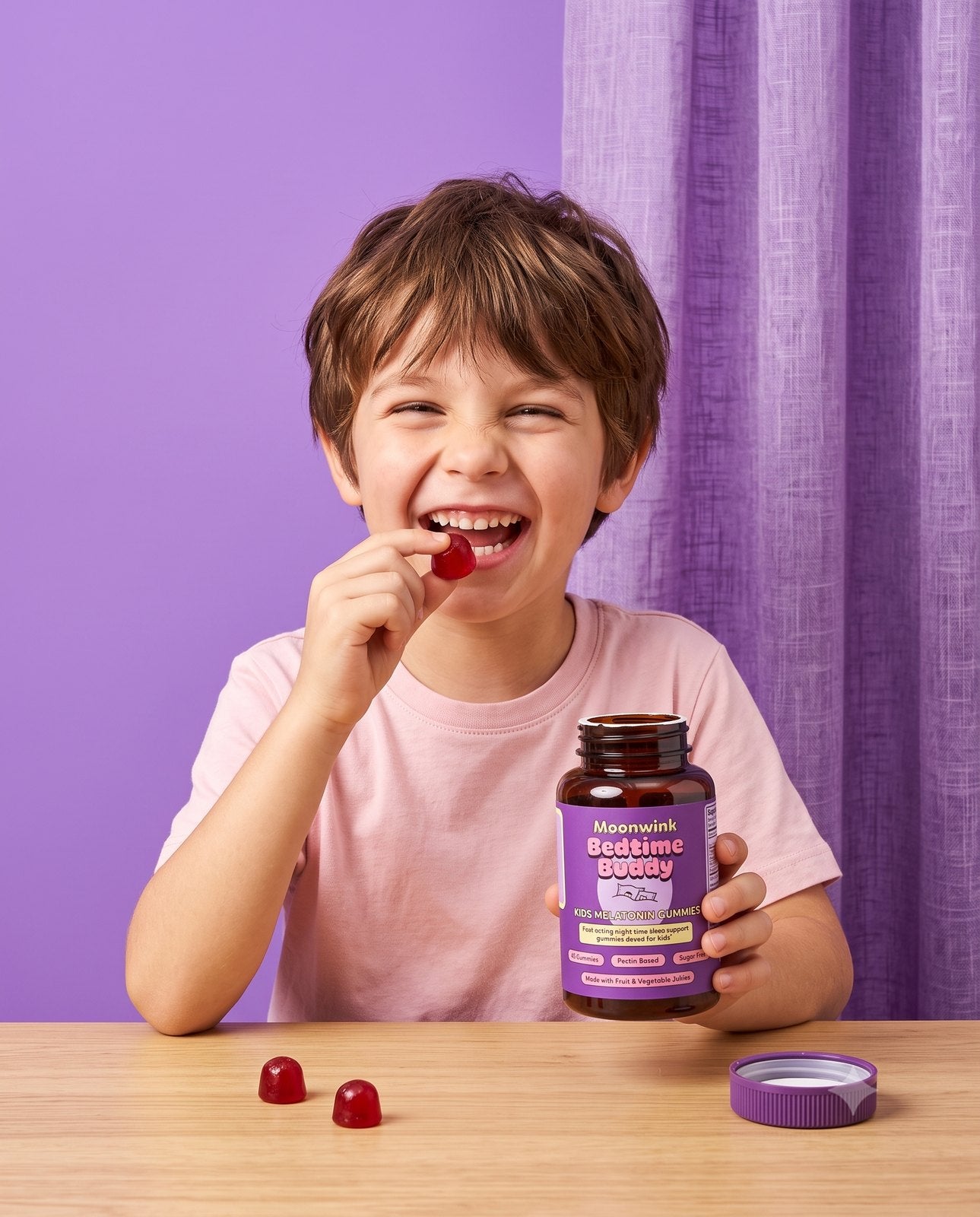 A happy child eating a Moonwink Bedtime Buddy gummy